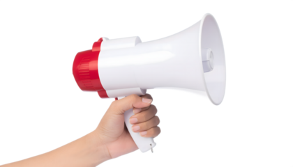 Hand holding white and red megaphone announcing loudly for attention and communication isolated on transparent background
