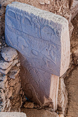 Detail view of stone carvings on T-shaped pillars at Gobeklitepe, the world’s oldest known temple complex, located in southeastern Turkey. © Tugrul