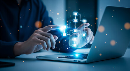 Man interacts with a glowing flowchart overlay on his laptop, representing a digital process or system.