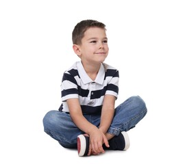 Cute little boy sitting on white background