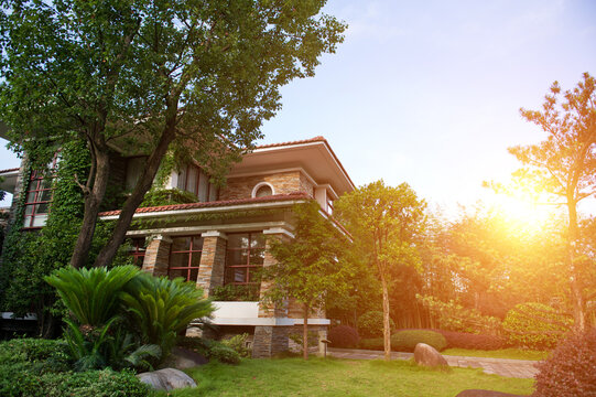 Brick suburban home on a sunny summer day.