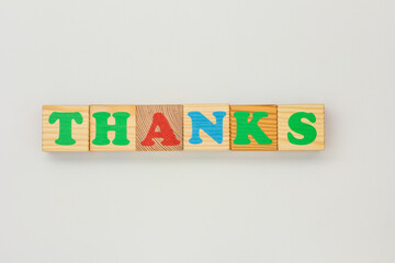 Thanks Spelled with Wooden Alphabet Cubes