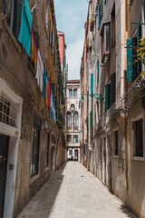 Fototapeta premium Stone apartment building alleyway in downtown historic Venice, Italy
