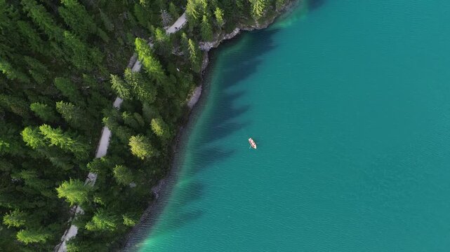 aerial view of the blue lake with canoe