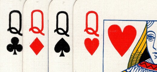Close up detail of four playing cards of the same value.