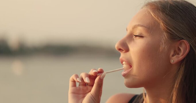Enjoying a refreshing treat by the water at sunset - Powered by Adobe