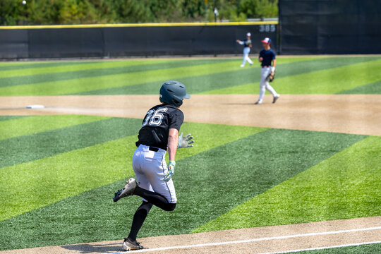 Baseball Player Sprinting to First Base