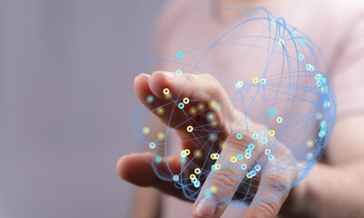 Person's hand touching a network of connections, representing global communication, future, innovation, and technological advancements.