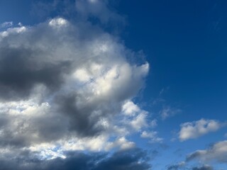 Dramatic Skyscape: Mostly white clouds with some dark, ominous clouds building.
