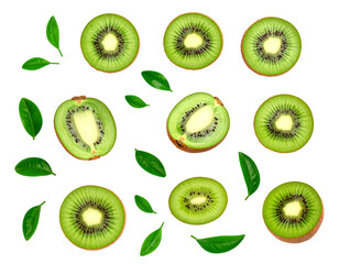 A collection of sliced kiwi fruits and scattered green leaves displayed on a black background in an aerial view