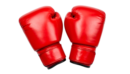 Two vibrant red boxing gloves are isolated against a black backdrop, ready for action