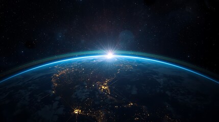 Fototapeta premium Earth from space with sunrise highlighting the planet and stars in the dark background of universe