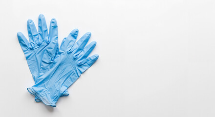 Blue medical gloves lying on a white background for healthcare use  