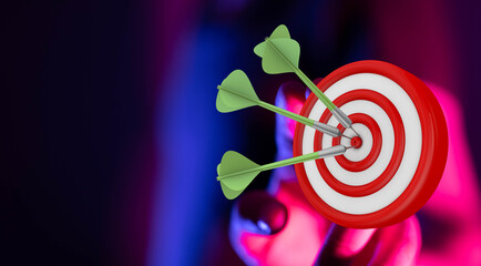 Close up of darts hitting the bullseye on a dartboard, representing focus, achievement, and hitting...