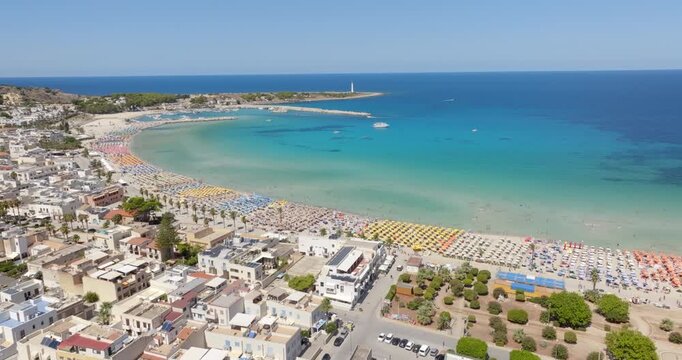 Aerial view of the beach at San Vito Lo Capo, a tourist destination with crystal, clear and turquoise waters located in the province of Trapani, Sicily, Italy. The small town overlooks the sea.