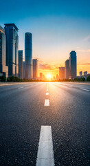 Empty road between skyscrapers