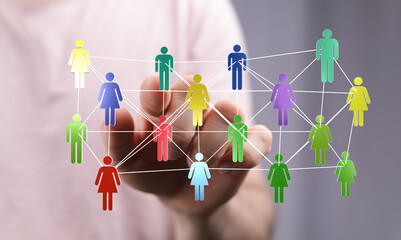 Hand reaching out to connected digital people, symbolizing a network, teamwork, or collaboration....