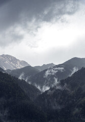 Misty Mountain Landscape with Cloudy Sky