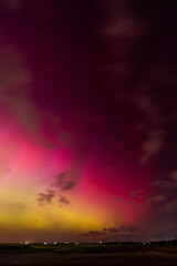Vibrant Aurora Borealis Over Dark Landscape