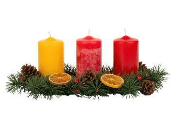 An advent wreath featuring one yellow and two red candles, surrounded by pine branches, pinecones, dried orange slices, and festive red berries. background removed