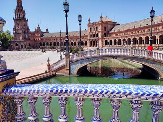 Plaza de Espa&ntilde;a in the Maria Luisa Park in Seville.  Lake with Azulejo tiled bridges along the pavilion buildings used as offices for the city hall in Spain square. July 30, 2025, Seville, Spain.