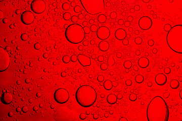 Close-up of red macro drink bubbles,abstract red wine bubbles, close-up shot,Macro Microscope red bubble texture close-up blood liquid, red macro bubbles Backgrounds red water drops on glass