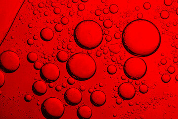 Close-up of red macro drink bubbles,abstract red wine bubbles, close-up shot,Macro Microscope red bubble texture close-up blood liquid, red macro bubbles Backgrounds red water drops on glass