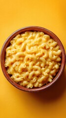 Creamy macaroni and cheese in a ceramic bowl, dish from United States on yellow background, minimalist food photo, template for social media, digital ads, web banners, mobile wallpapers, greeting card