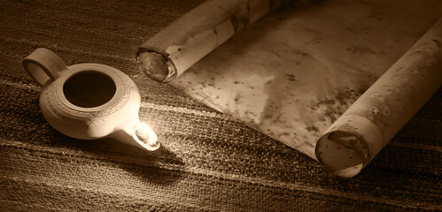 Old oil lamp and scroll