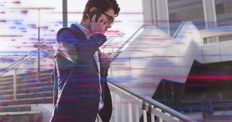 Talking Asian businessman carrying backpack and holding smartphone on stairs by railing, copy space