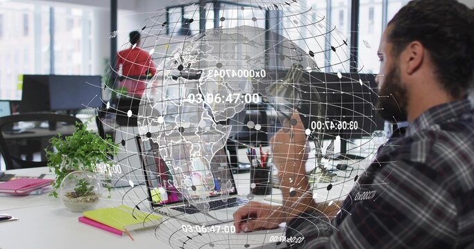Software coder wearing flannel typing on laptop at office desk, with holographic globe, copy space