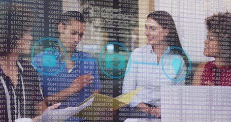 Collaborating team wearing business attire pointing at laptops in meeting room, with security icons