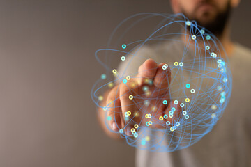 Abstract image of hand reaching towards a digital sphere, concept of global network, technology,...