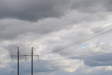 Fototapeta premium Power Lines Set Against a Stunning and Dramatic Cloudy Sky with Heavy Overcast Conditions