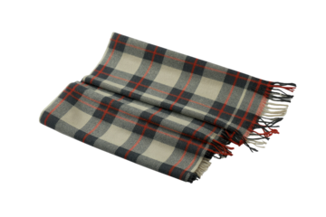 A cozy folded plaid scarf in cream, dark grey, and red tartan pattern, featuring fringed ends, on a transparent background. background removed