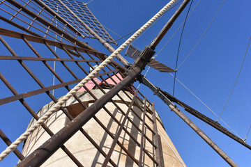 Detail of mill in Marsala. Trapani wind mill sea salt production. The salt flats with a windmill....