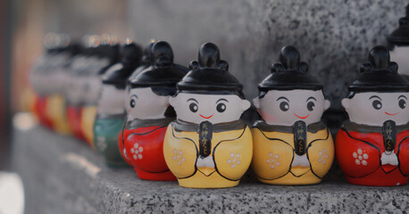 Colorful Japanese Shrine Hina Doll Figurines in Sunlight