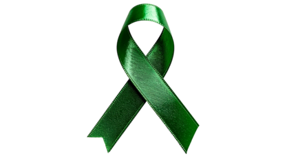 Close-up of a lustrous, green ribbon symbol, floating against a solid black background
