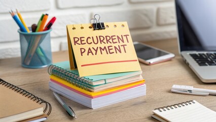 Yellow Calendar with Recurrent Payment Reminder on a Desk