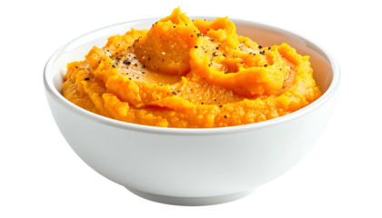 Bright orange, textured mash in a white bowl, sprinkled with black pepper