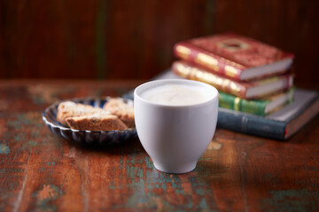 Cappuccino on dark wooden background. Soft focus. Close up.	