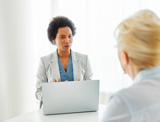 Obraz premium Senior man or businessman having a meeting with an agent using a laptop computer , businesswoman, salesperson or doctor in his office