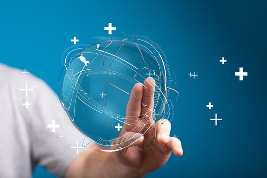 Conceptual image of a person interacting with a digital globe, symbolizing technology, global connectivity, and healthcare with plus signs.