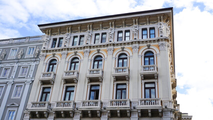 Obraz premium The streets of Trieste with the facades of old and colorful Mediterranean houses. Trieste, Italy