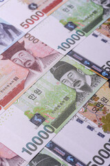 Korean paper money, won, and cash banknotes for financial transactions. Korean money