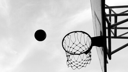 A dramatic view of a basketball about to score
