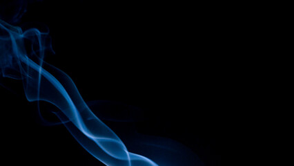 Elegant blue smoke swirling against a black background