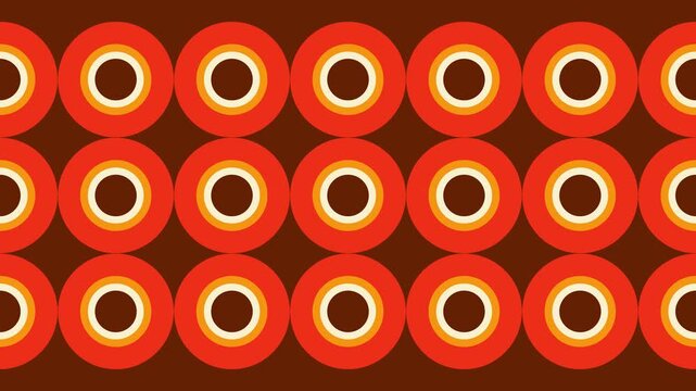 A seamless bold retro geometric pattern of concentric circles in warm orange, yellow, and brown tones. 1970 design vintage background.