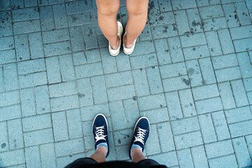 The dynamic of a modern urban relationship, showing the space and distance between two people