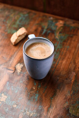 Cup of coffee on rustic wooden background. Soft focus. Copy space	